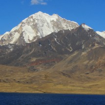 Laguna Tuni with Huayna Potosi, Maria Lloco and the house of the caretaker of the water for La Paz (down left corner)